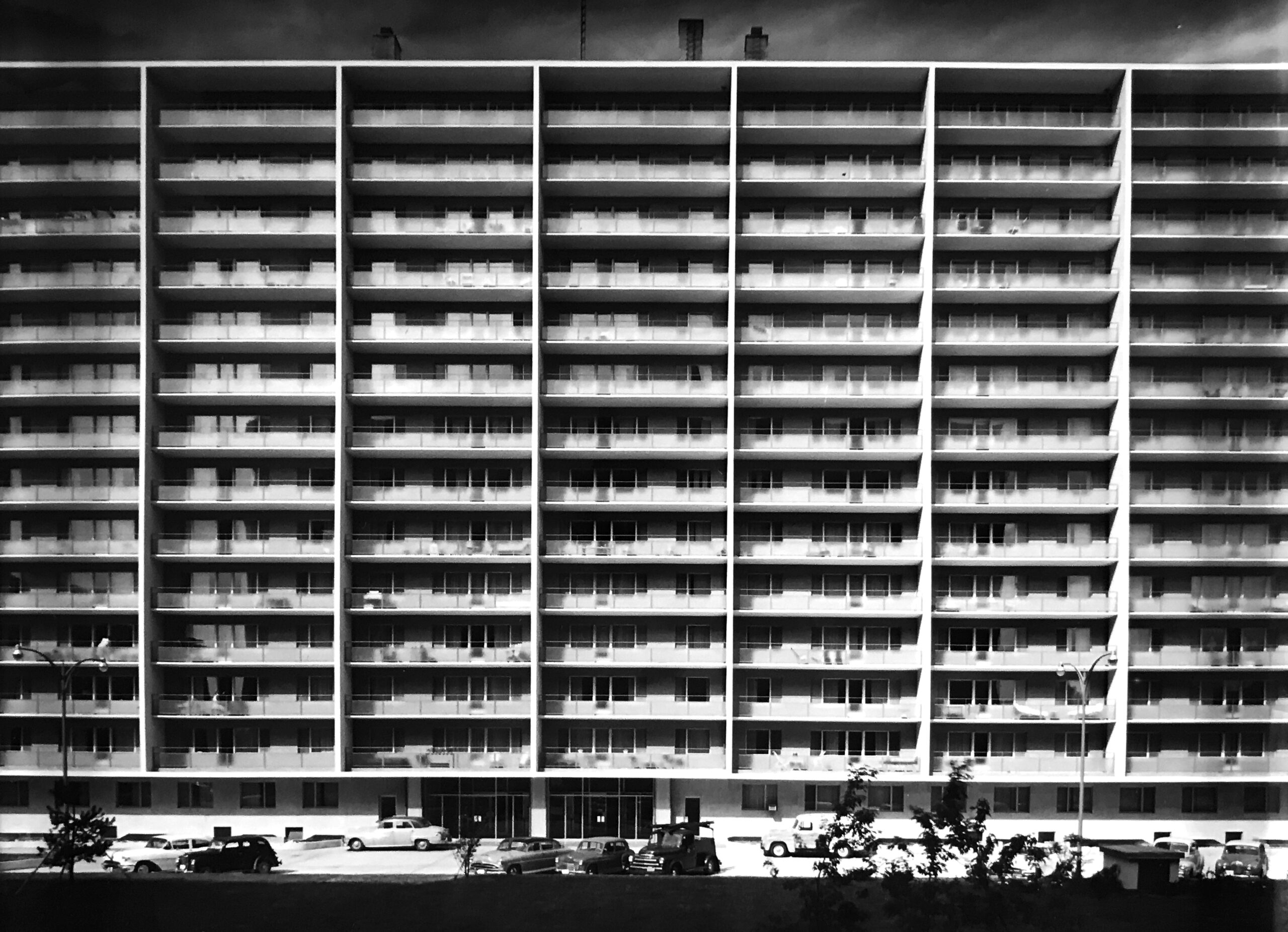 Black and white image of a 14-storey Mid-Century Modern apartment building