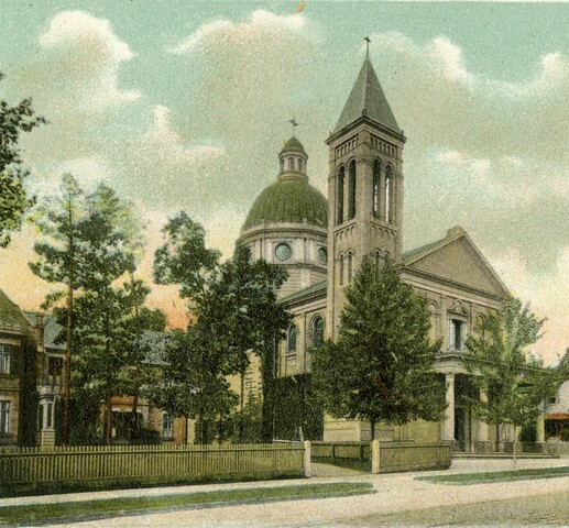 An illustration of a church, set back from a road lined with trees. The church features a tower and a dome as well as a front portico. To the left of the church is a two-storey home.
