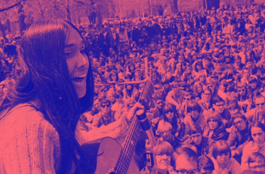 Blue and pink tones and overlay on an image of a crowd with a female performer playing the guitar in the foreground.