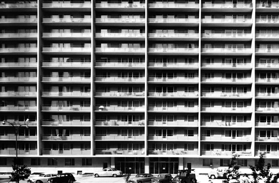 Black and white image of a 14-storey Mid-Century Modern apartment building
