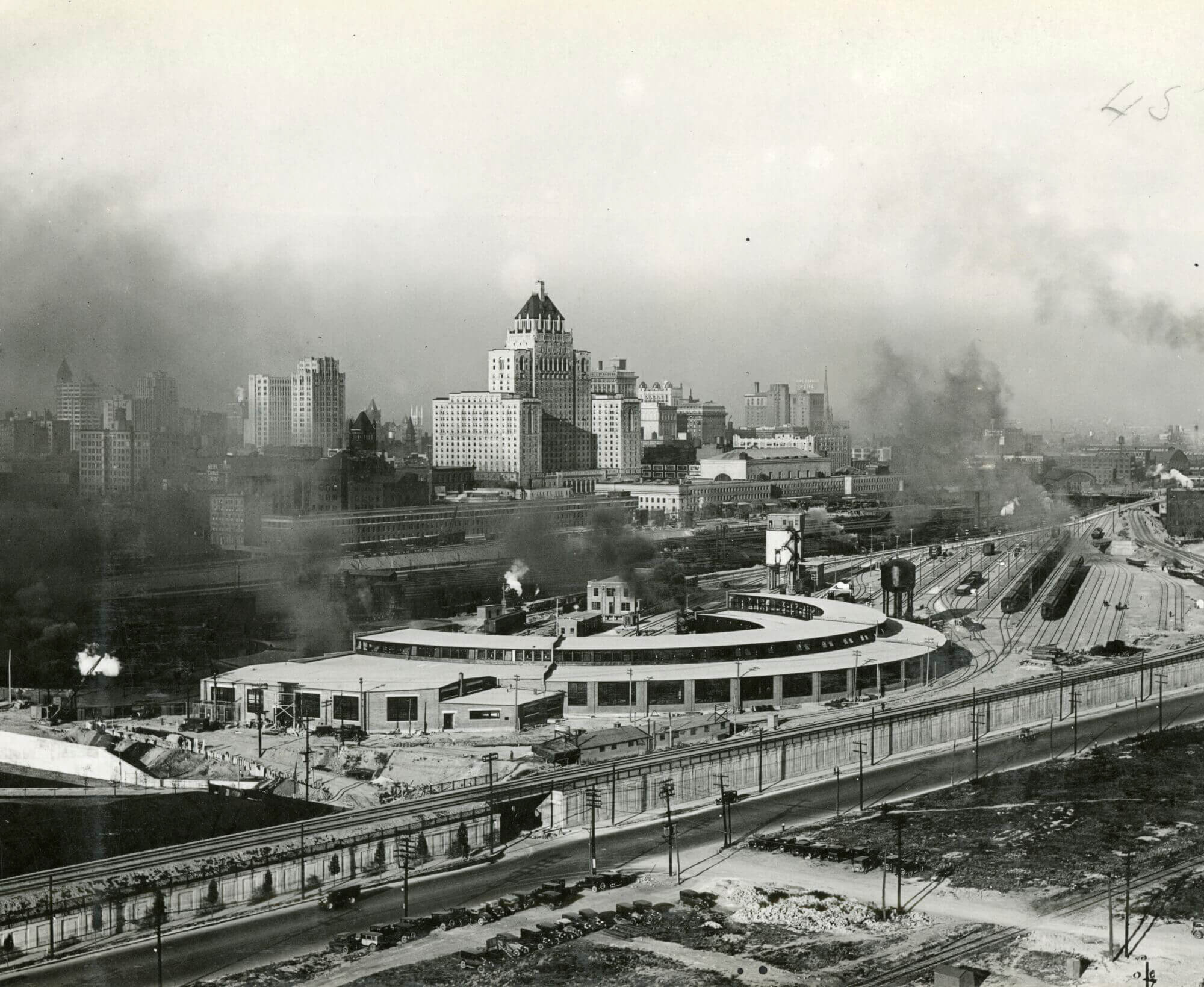 Black and white image of CPR roadhouse. Its a semi-circle shape, so that trains can enter/ exit from multiple directions