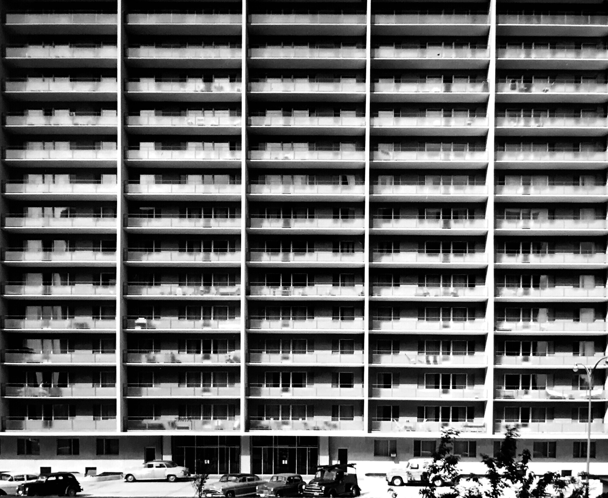 Black and white image of a 14-storey Mid-Century Modern apartment building