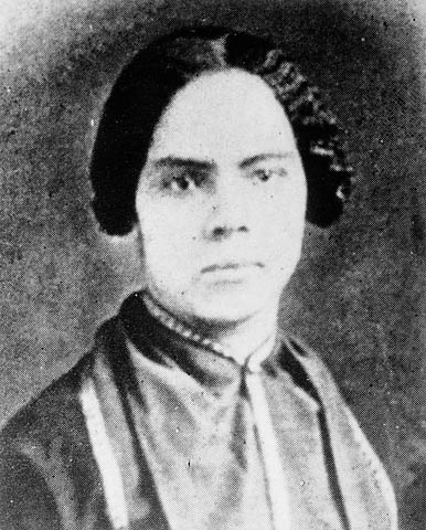 Black and white portrait photograph of a woman in 19th-century dress