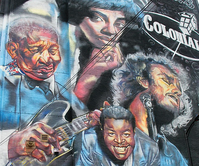Lower portion of the 70-meter-tall music history mural by Adrian Hayles on the north side of the apartment building at 423 Yonge Street, 2019. Photograph courtesy of Downtown Yonge BIA.