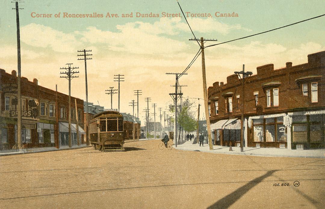 A street scene featuring several brick buildings and a streetcar in the center.