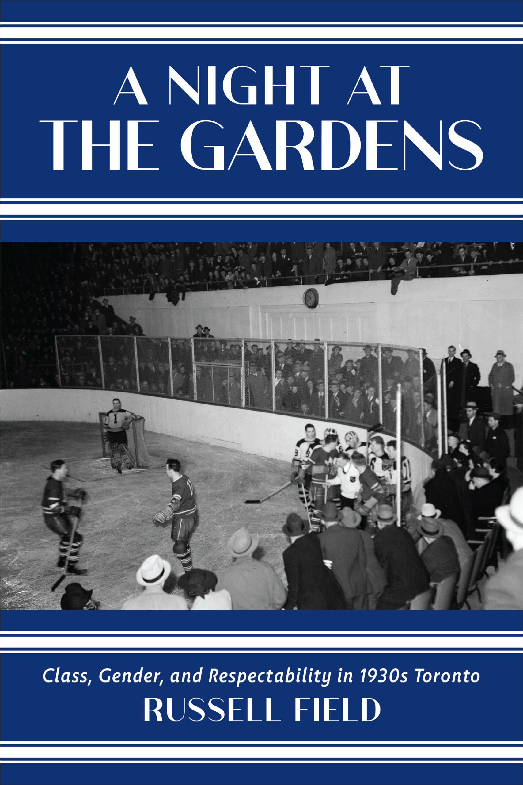 A black and white photo of a hockey fight in the centre of the cover with blue and white stripe banners at the top and bottom of the cover. "A Night at the Gardens" is written in white text in the middle of the top blue banner.