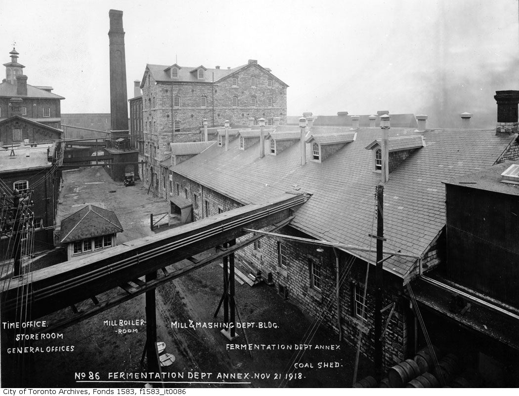 Black and white photo of an industrial plant with many buildings.